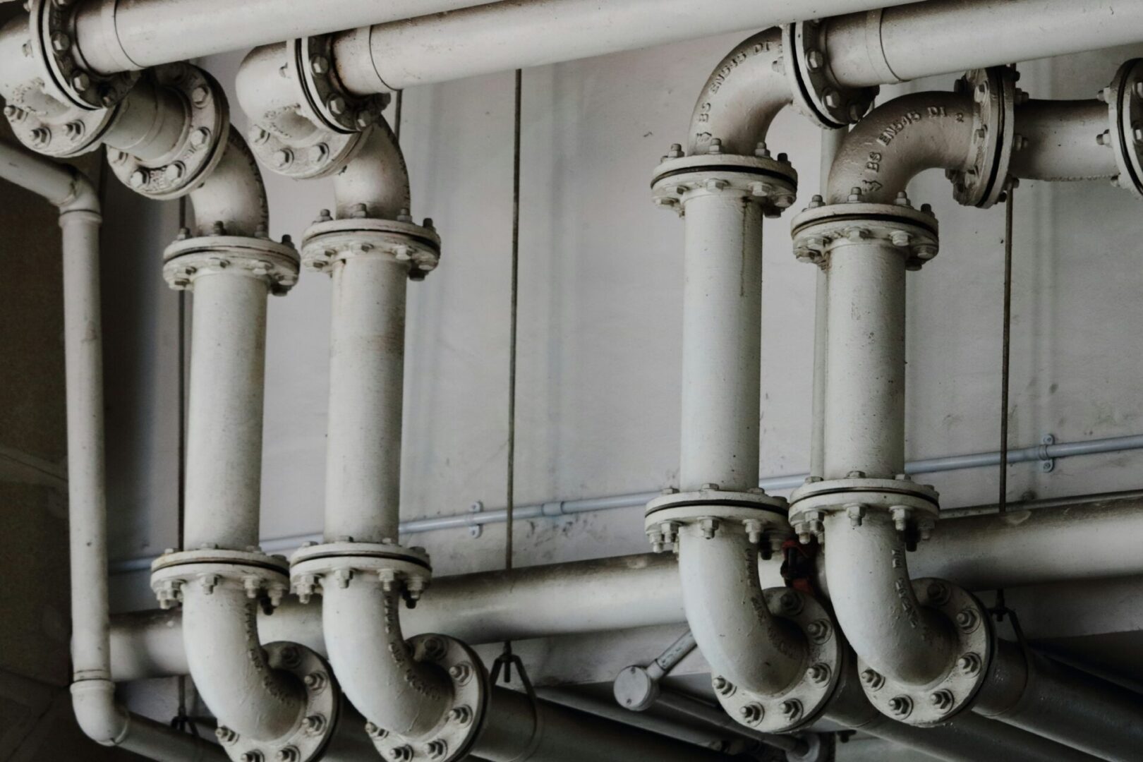 A bunch of pipes that are in the wall