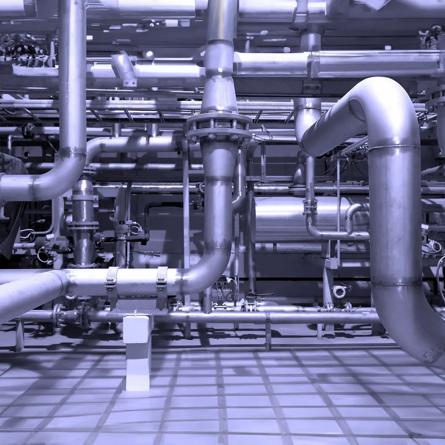 A large industrial area with pipes and valves.